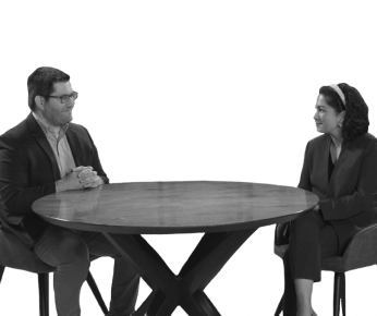 man and woman sitting at a table