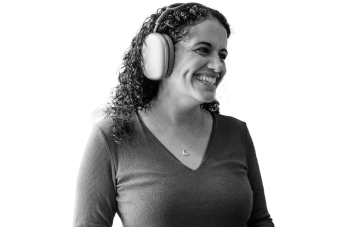 woman wearing headphones and smiling