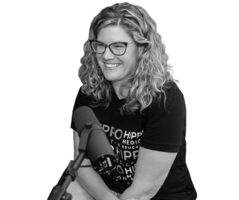woman smiling with a microphone